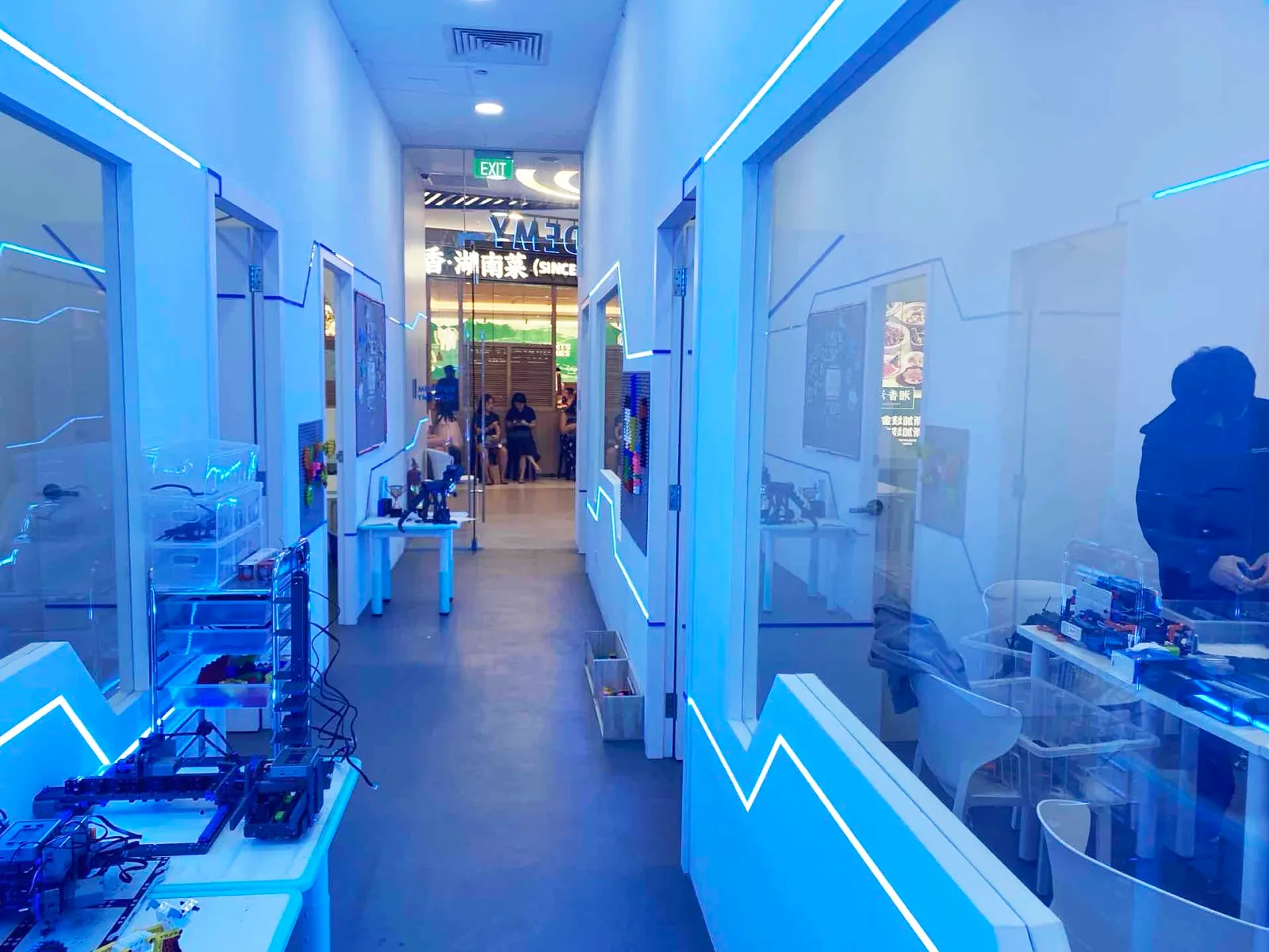 The blue-lit robotics corridor of a Futurum Academy centre