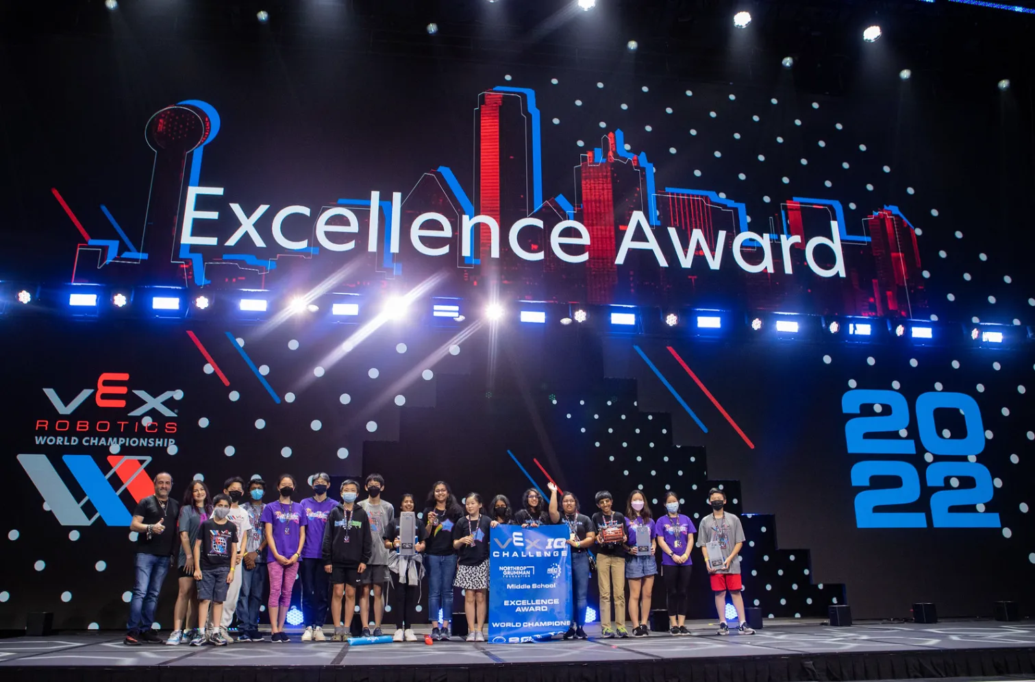 A student team on stage receiving the Excellence Award at the VEX Robotics World Championship