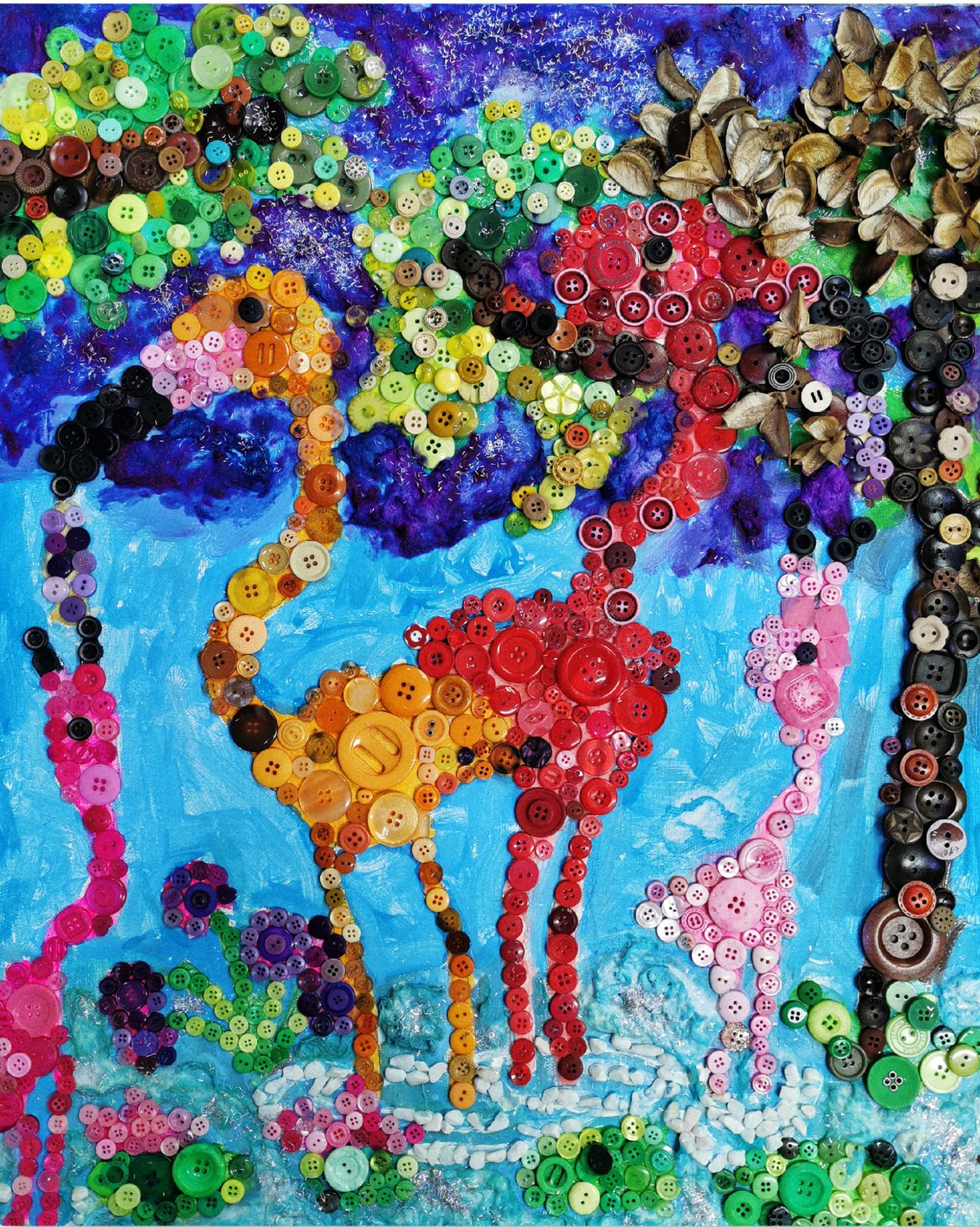 Three flamingos built from pink buttons and dried seed pods on a painted background
