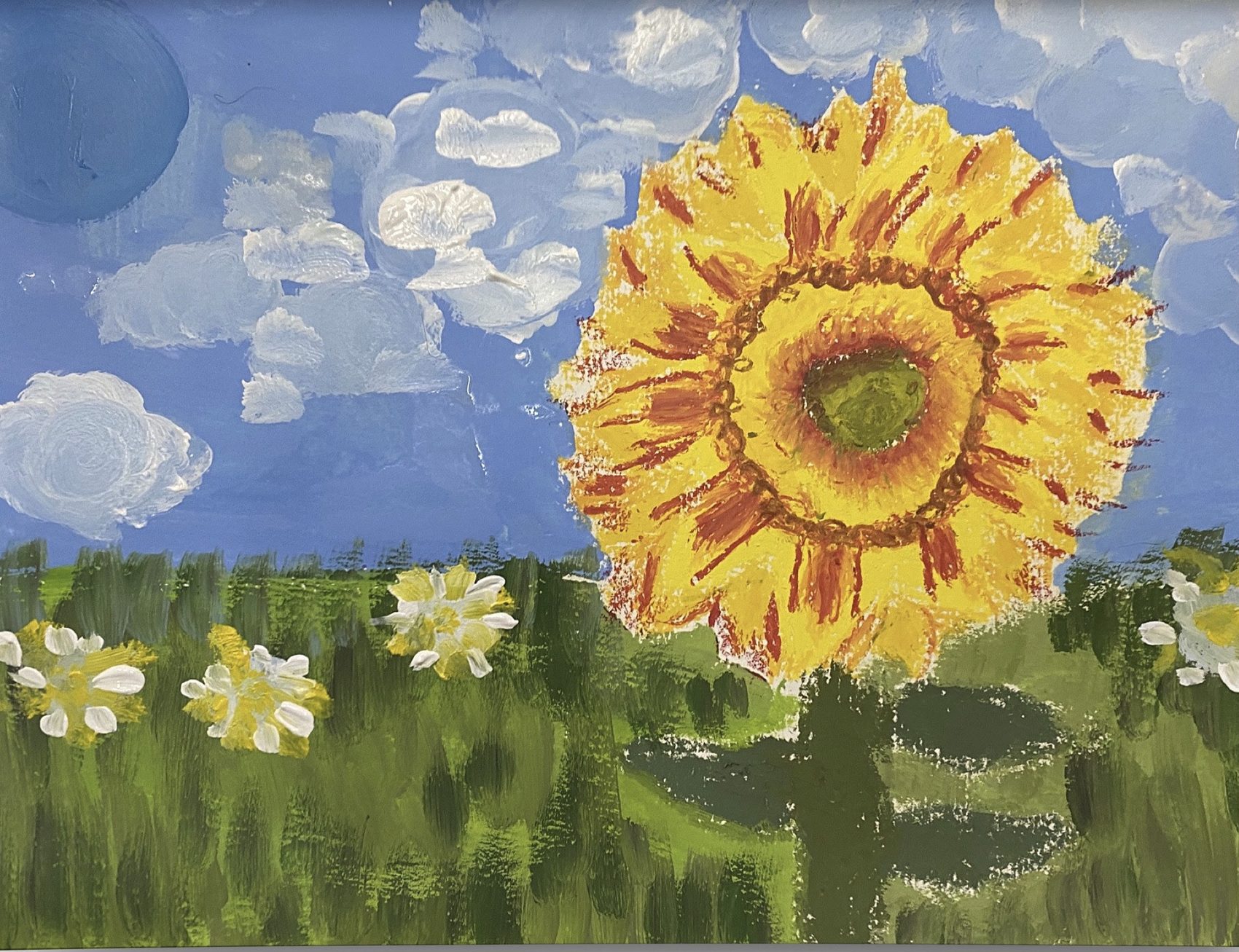 Large sunflower with a heavily textured oil pastel head against an acrylic sky and meadow