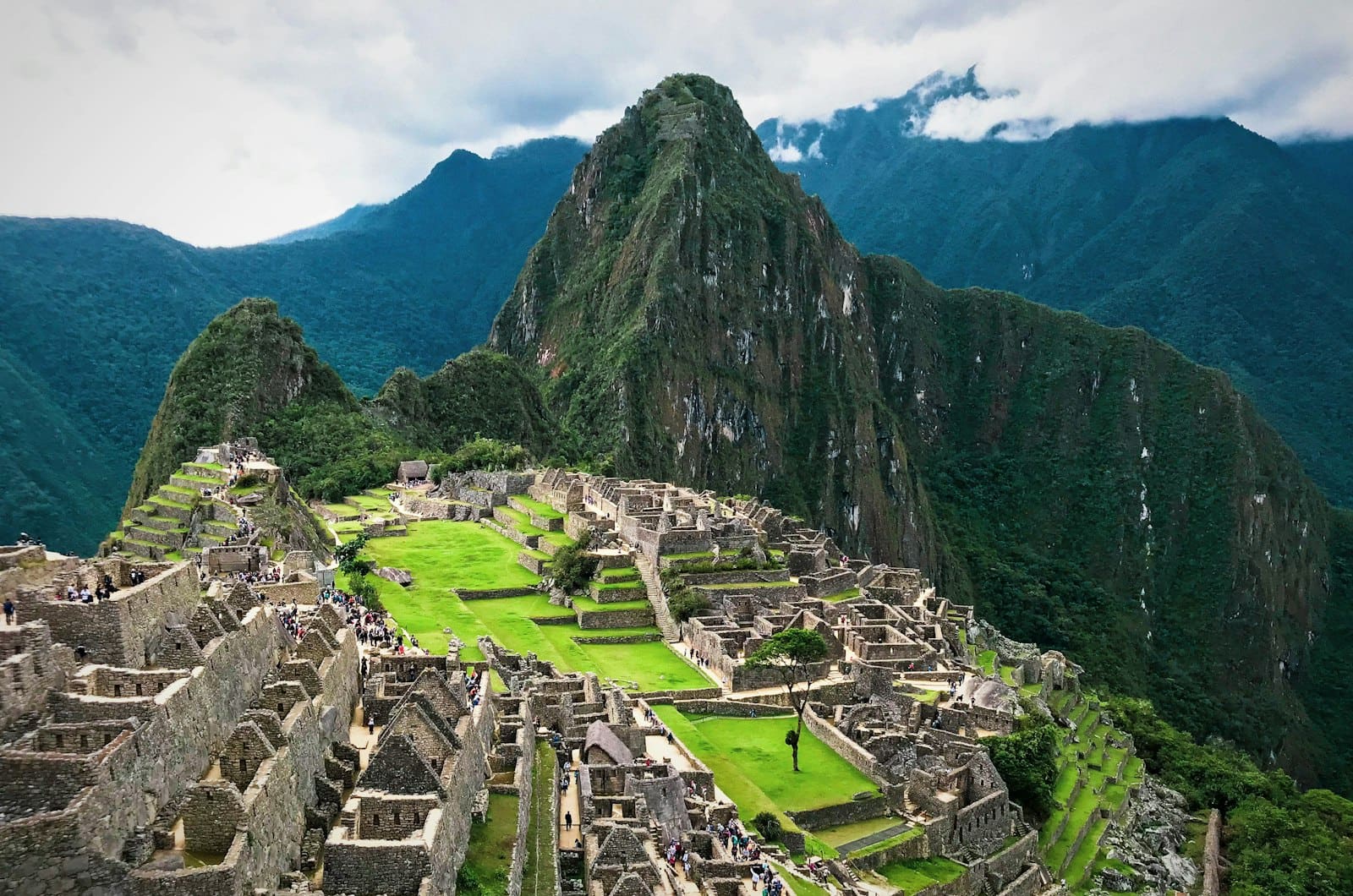 Machu Picchu's terraces beneath green Andean peaks