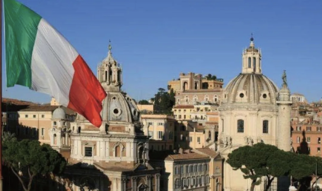 Italian flag overlooking Rome's historic architecture