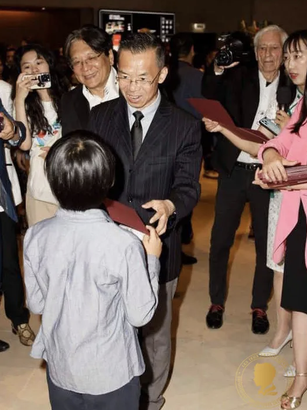 Guests meeting young artists at a previous exhibition