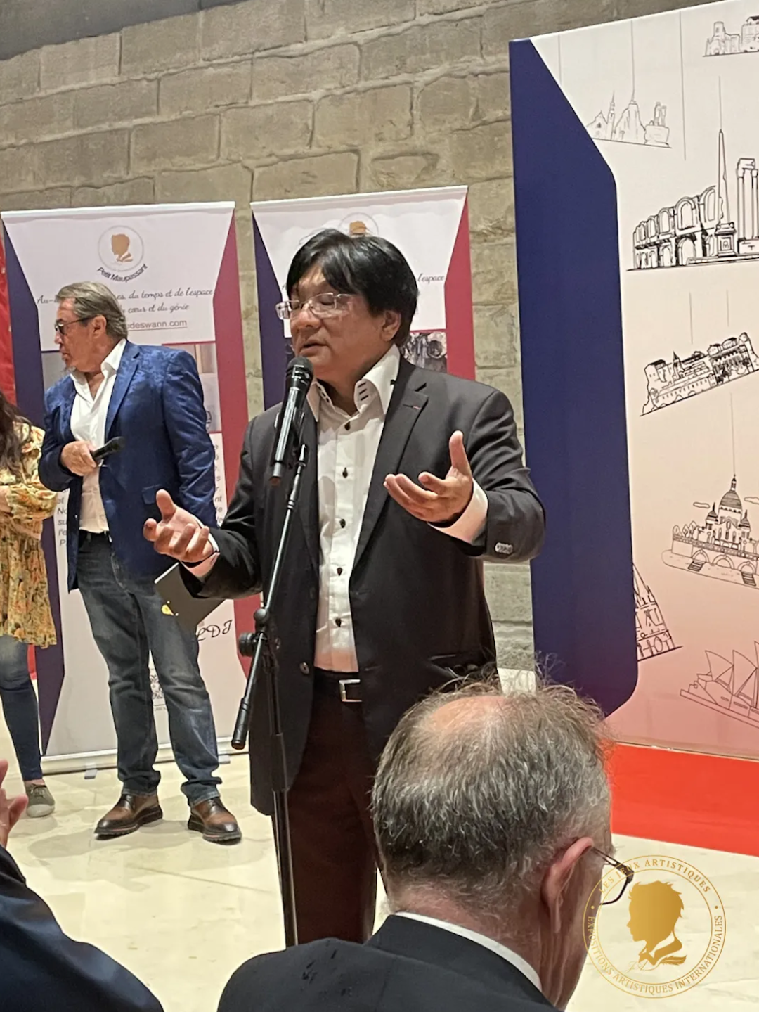 A speaker addressing visitors at a previous exhibition