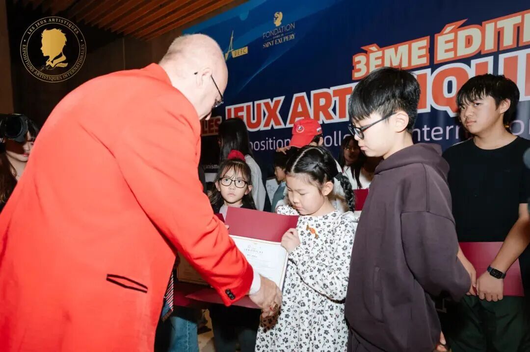 Young artist receiving an award