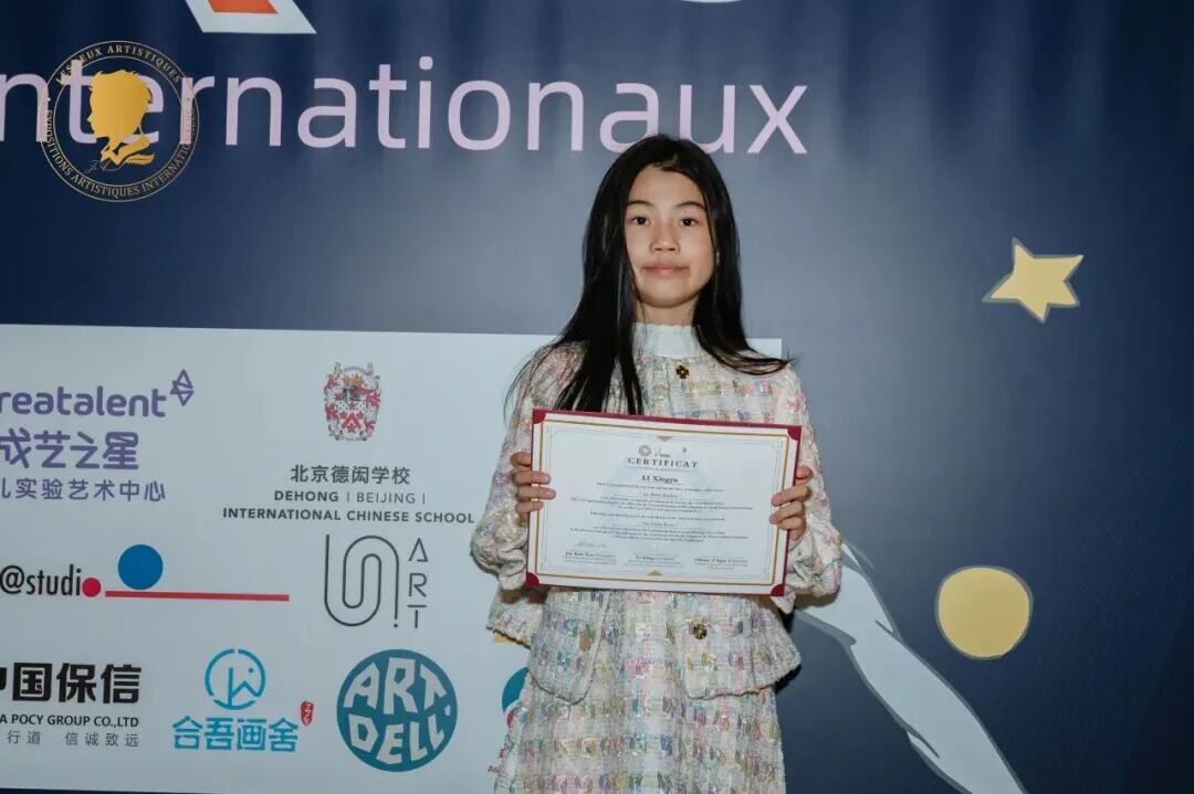 Participant displaying an international exhibition certificate