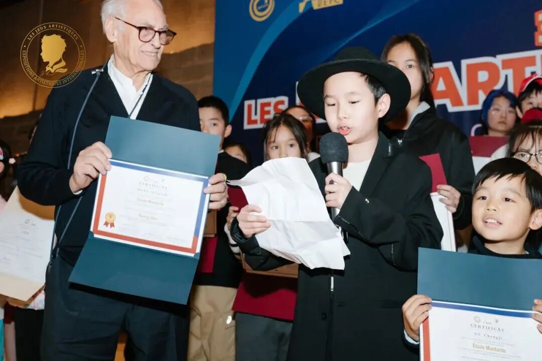 Young artist speaking while receiving an award